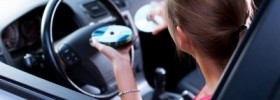 Woman Changing CD's in the car